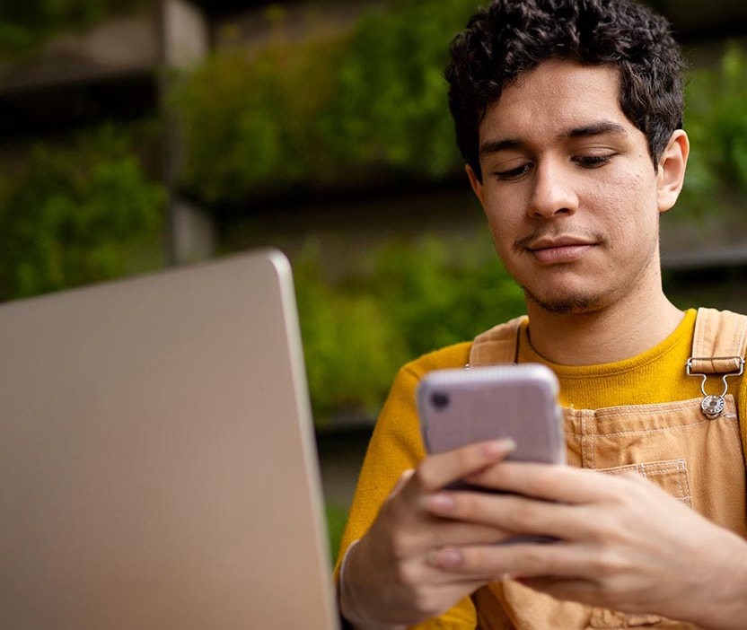 A man turns off the Bluetooth on his phone to help reduce the risk of bluejacking.