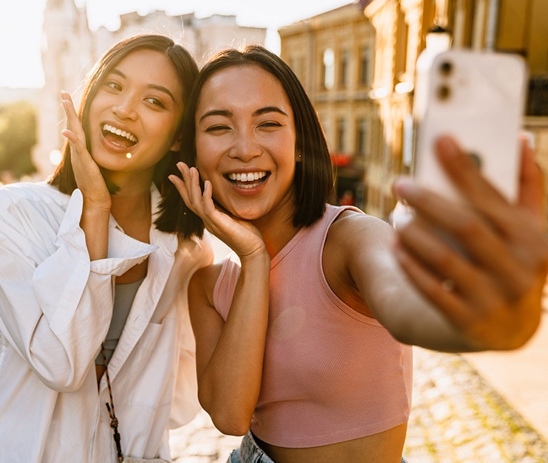 Two friends taking a selfie on Snapchat.