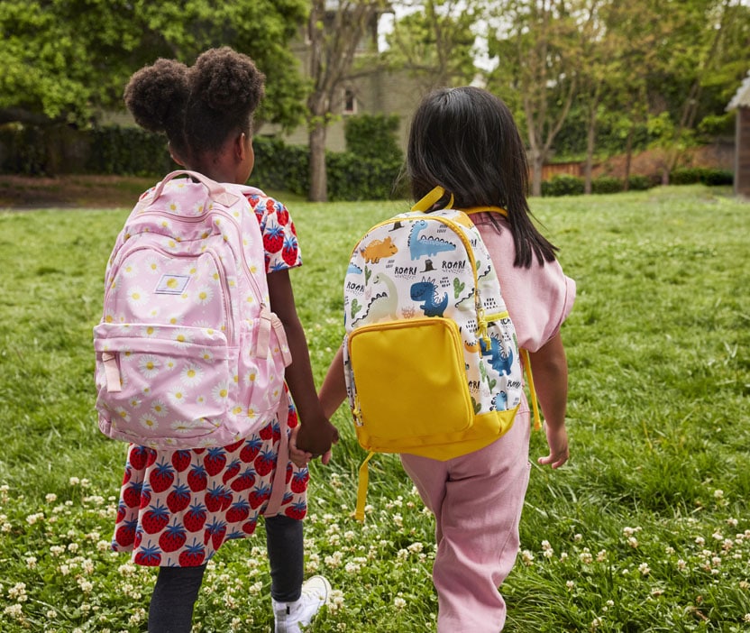 Two children walking to school to learn about data backups.