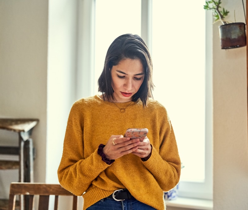 A woman notices a suspicious notification from Facebook.