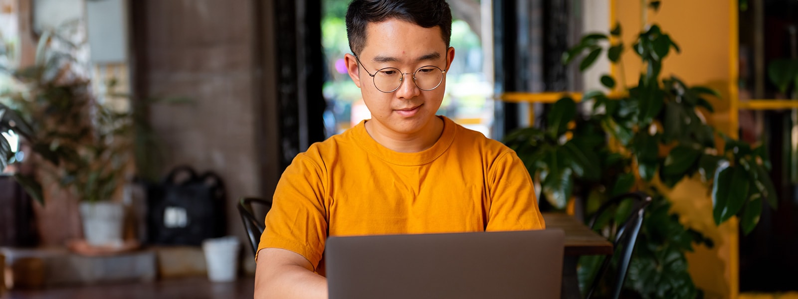 Man on a laptop learning how to update operating systems.