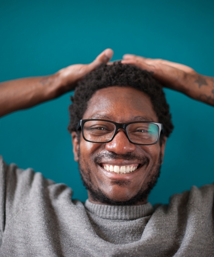 A cyber geek smiles into the camera.