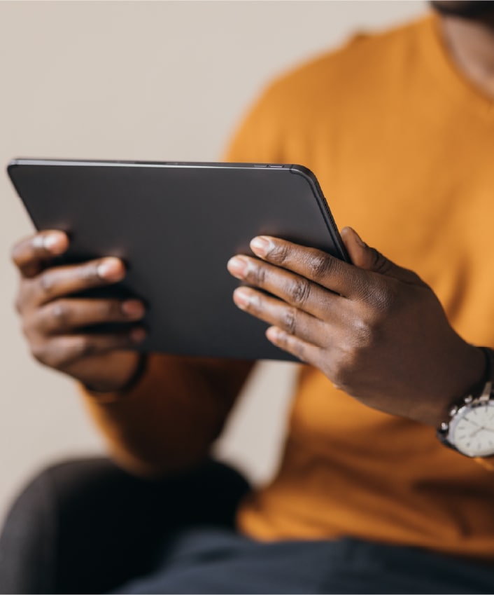 A person reads about data brokers on their tablet