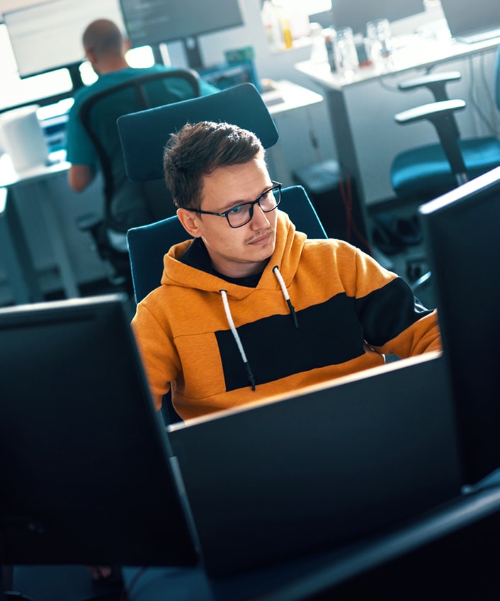 A man researches hacktivism on his computer.