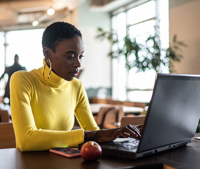 Woman researching how to remove a heuristic virus from her device.