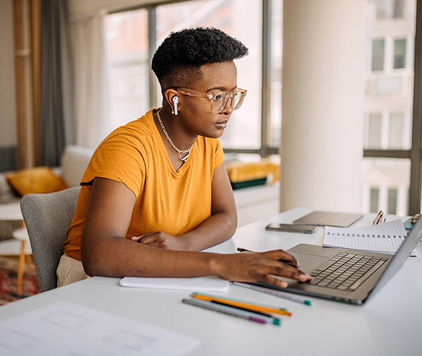 A woman learns how to install a VPN on a router after reading a how-to guide.