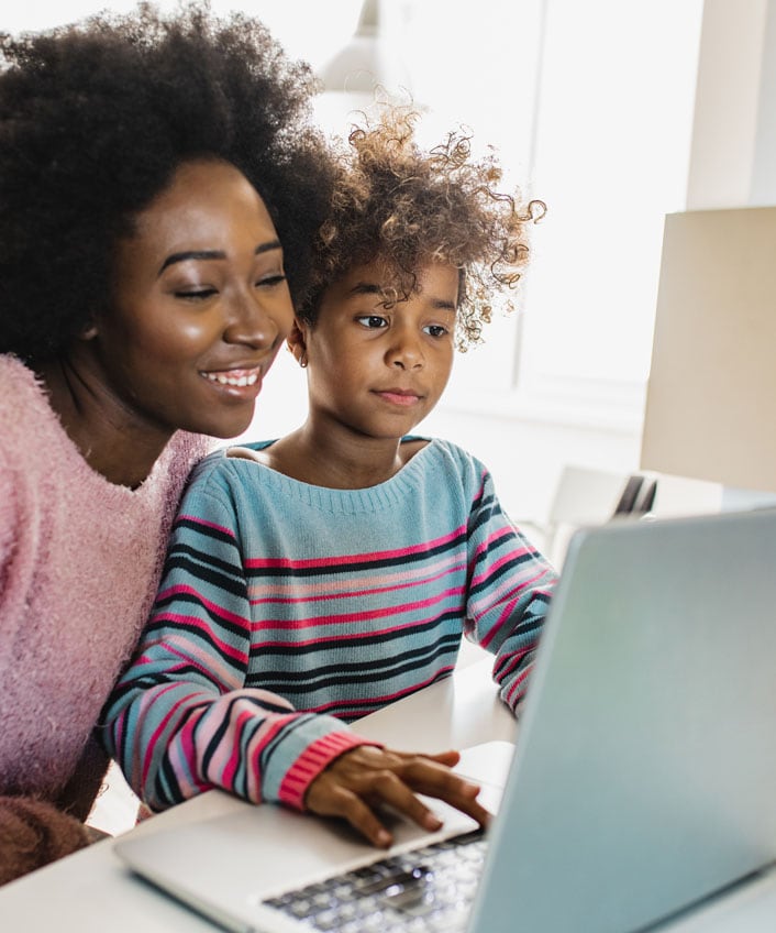 A family researching the warning signs of a potential router hack.