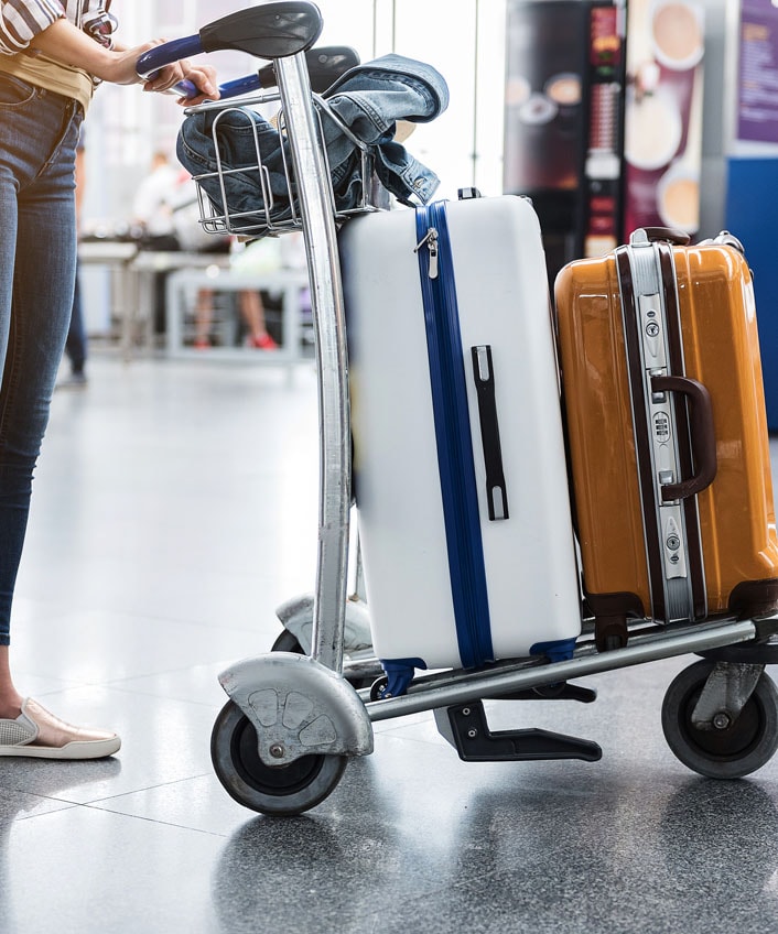 A woman walking through airport wondering how to prevent malware