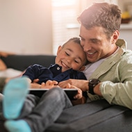 A family enjoys their secure WiFi setup while browsing on their devices.