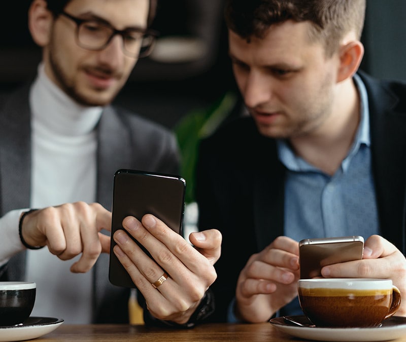 Two people sending data encrypted with MD5 hash from one phone to another.