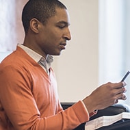 A man protecting his cellphone number from phone account takeover fraud.