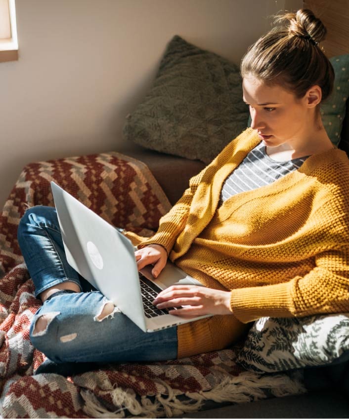 A woman reads about scareware on her laptop