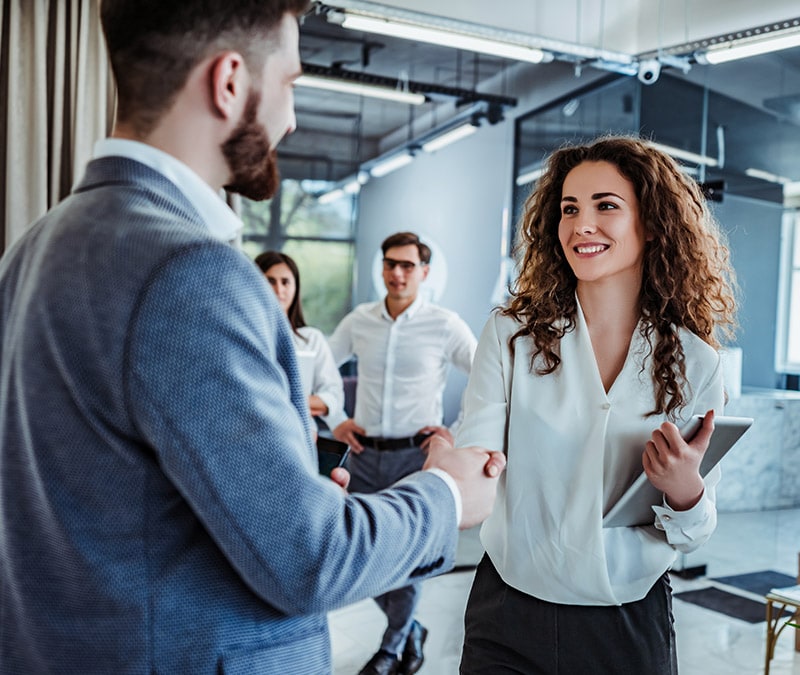  Two co-workers discuss netiquette or the rules for behaving well online.