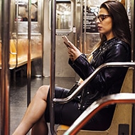 Person on train researching how to stay safe online.