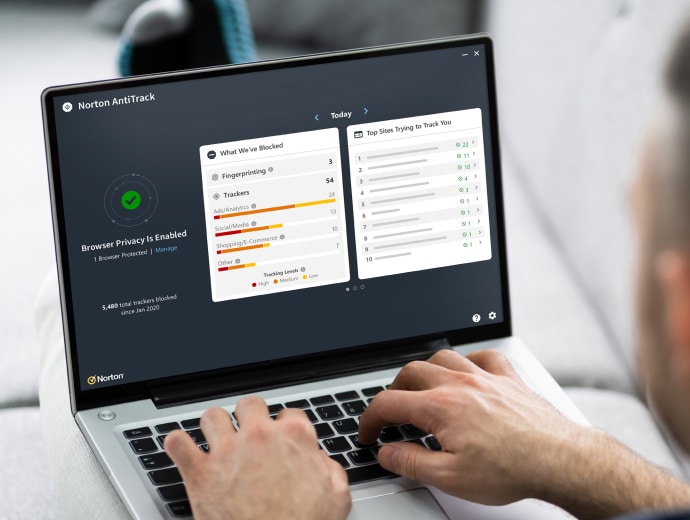 Norton AntiTrack man typing on laptop