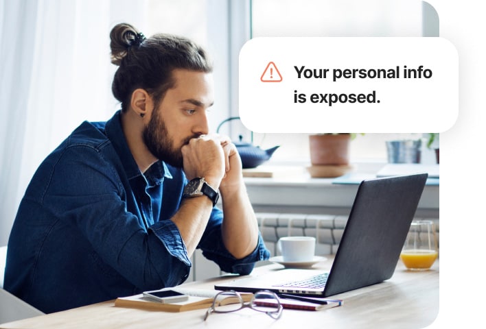 Man sitting at desk on a laptop