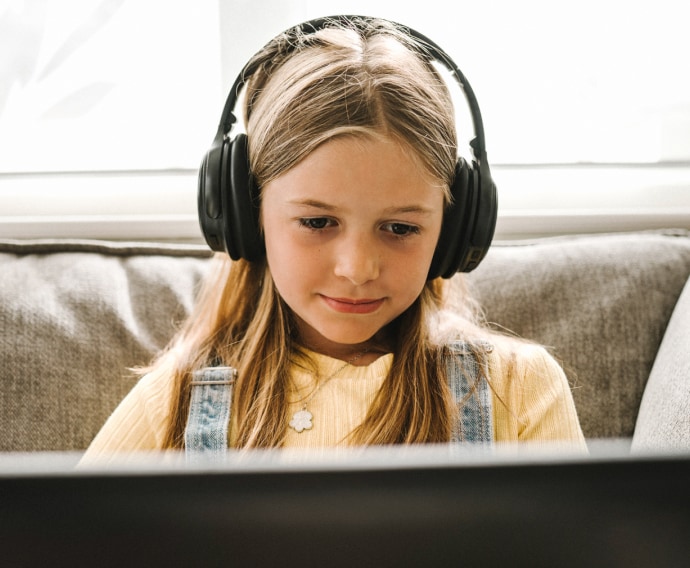 Little girl with headphones.