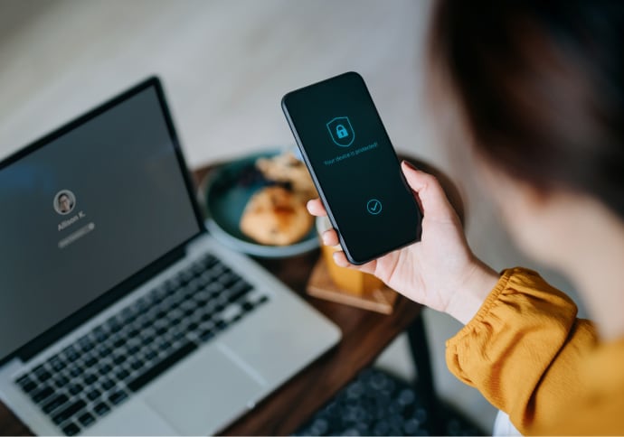 Young woman logging in to her device.