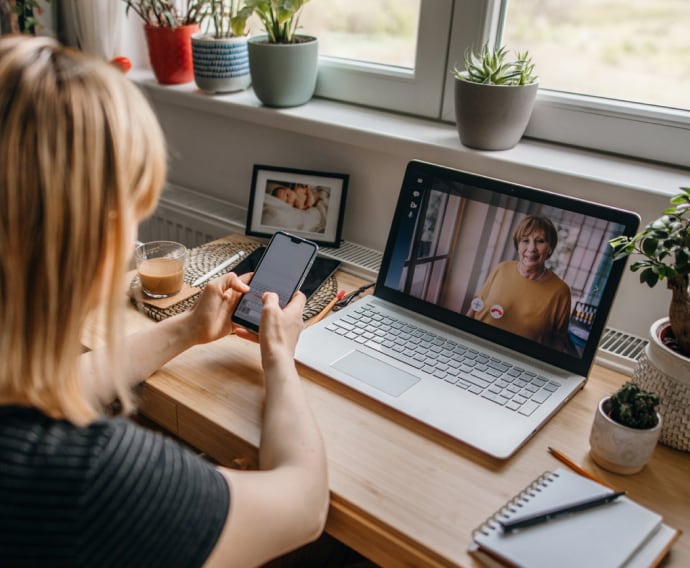 Young woman using device.